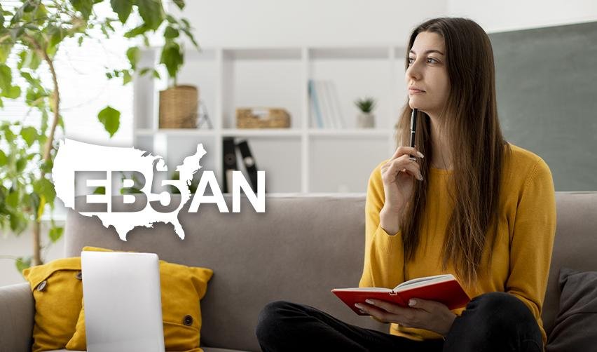 An EB5 investor sitting next to the EB5AN logo and thinking with a notebook and pen in her hand about her conditional permanent resident application.