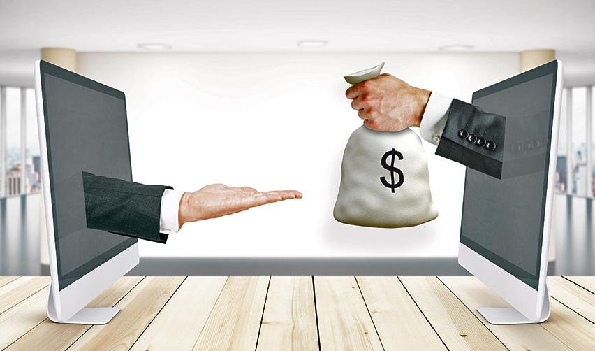 A conceptual image of a digital financial transaction, with one hand extending money and another hand reaching out, representing online lending and bank financing options for EB5 investors.