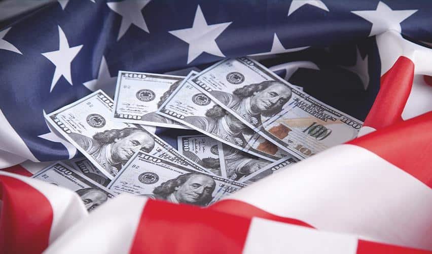 U.S. hundred-dollar bills surrounded by the American flag, representing EB5 investment funds supporting economic growth and U.S. residency opportunities.