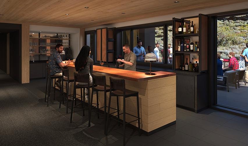People sitting at a bar at the Snake River Sporting Club.