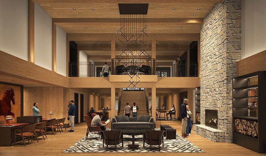 A room in the SR sporting club with a fireplace and people.