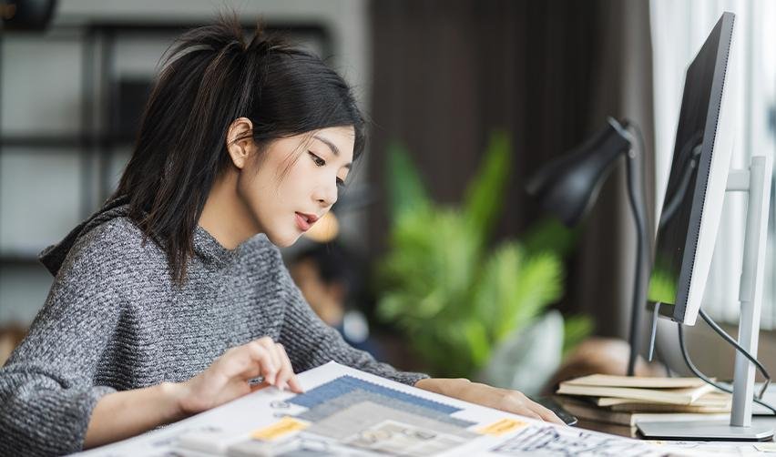 An EB5 dependent family member studying in front of a computer.