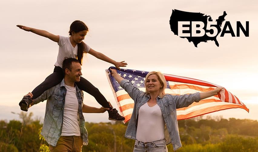 A family of foreign investors celebrating their EB5 Green Card outdoors with U.S. flags, next to the EB5AN logo.