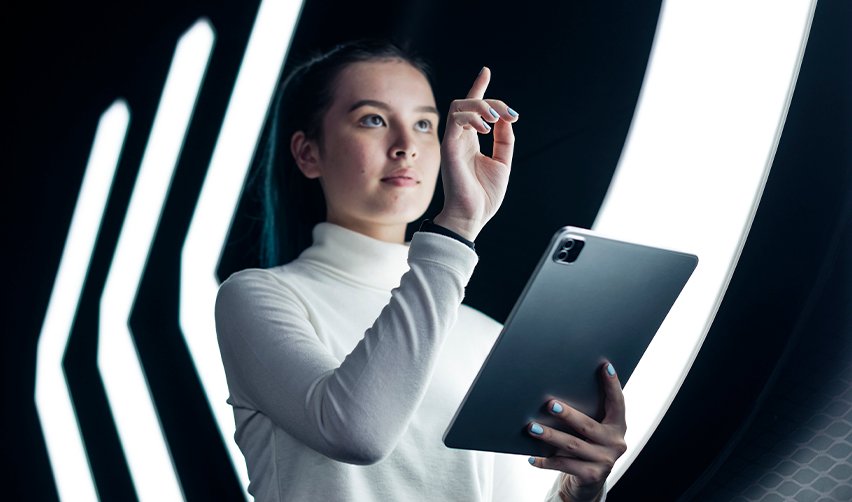 An EB5 investor with a tablet in her hand in a futuristic setting, symbolizing America's future built on innovation.