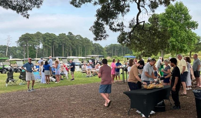 Residents of Bay Creek coming together at a picnic event.